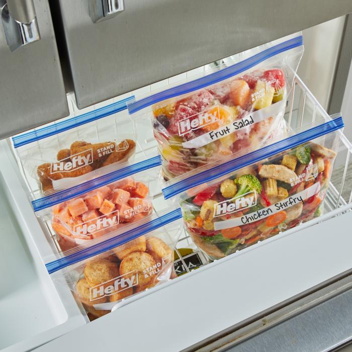 Freezer filled with several different sized Hefty Press to Close freezer storage bags