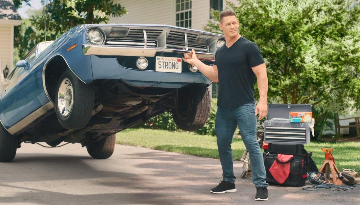John Cena lifting up a car
