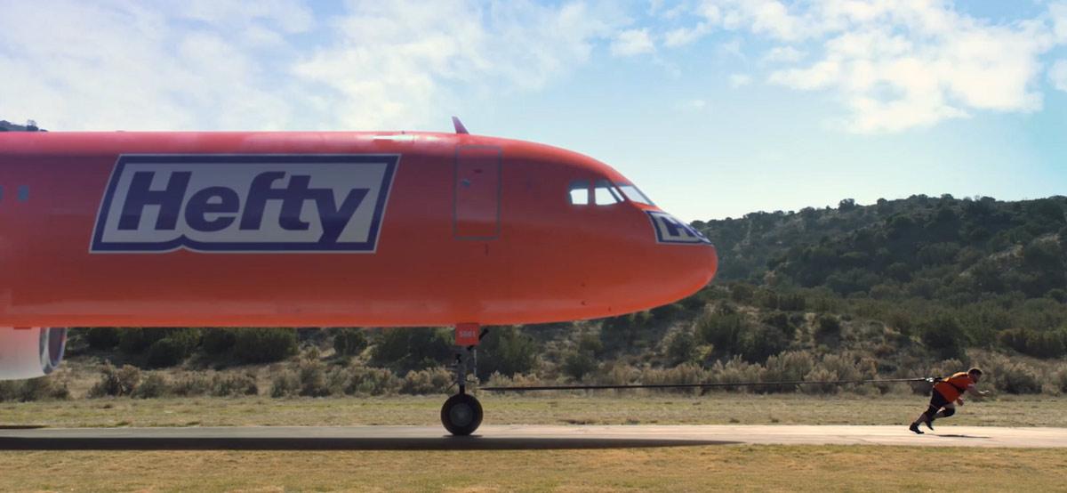 Hefty Plane being pulled by a strong man