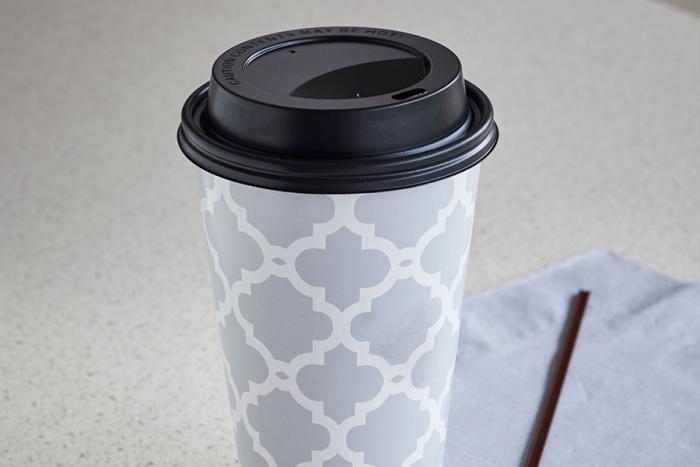 Insulated hot beverage cup on counter