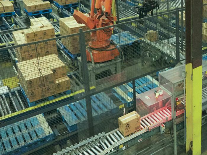 Image of a box of product being pushed down a line at one of the manufacturing plants
