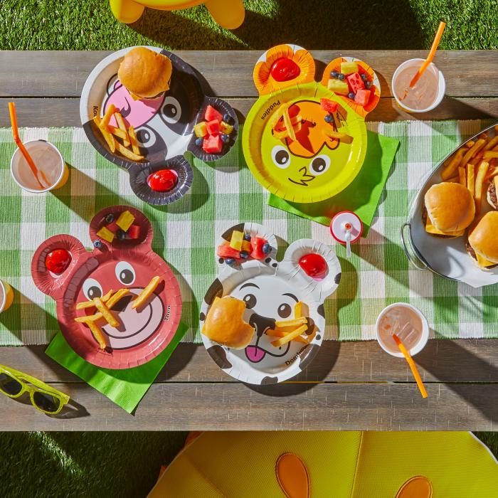 Hefty Zoo Pal plates sitting on a picnic table with sliders, fries and fruit