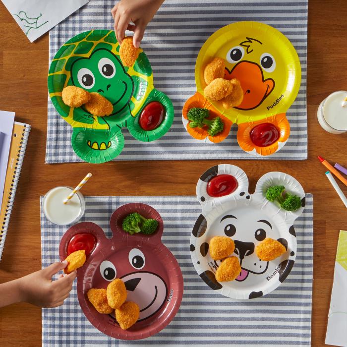Children dipping chicken nuggets on Hefty Zoo Pals plates