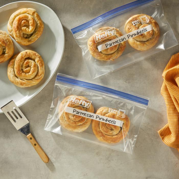 Pinwheels sitting in half gallon sized Hefty Press to Close freezer storage bags sitting on a kitchen counter