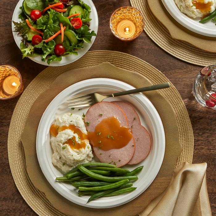 Hefty 9 inch ECOSAVE plate topped with ham, mashed potatoes and green beans