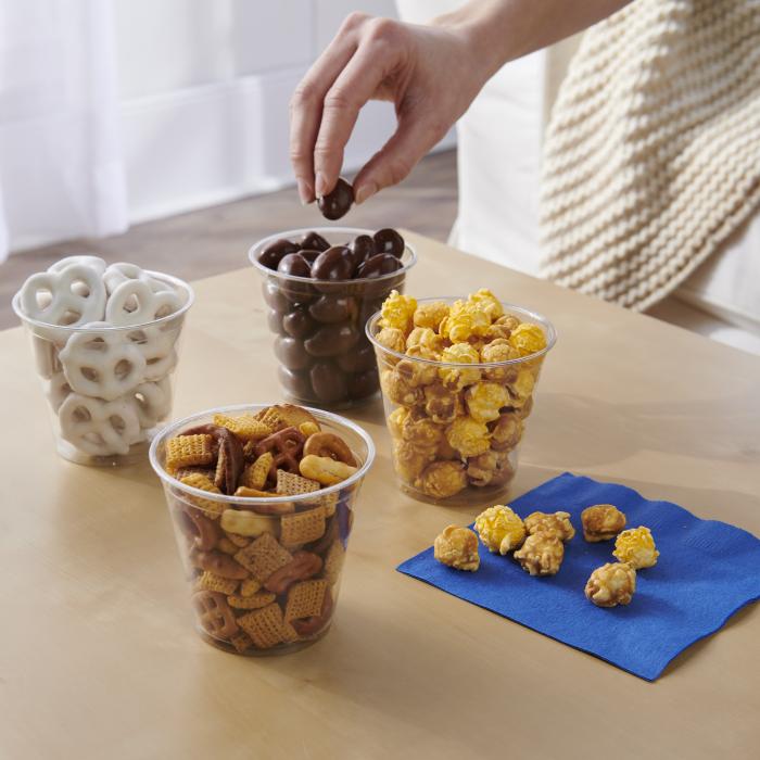 9oz clear cups filled with a variety of snacks