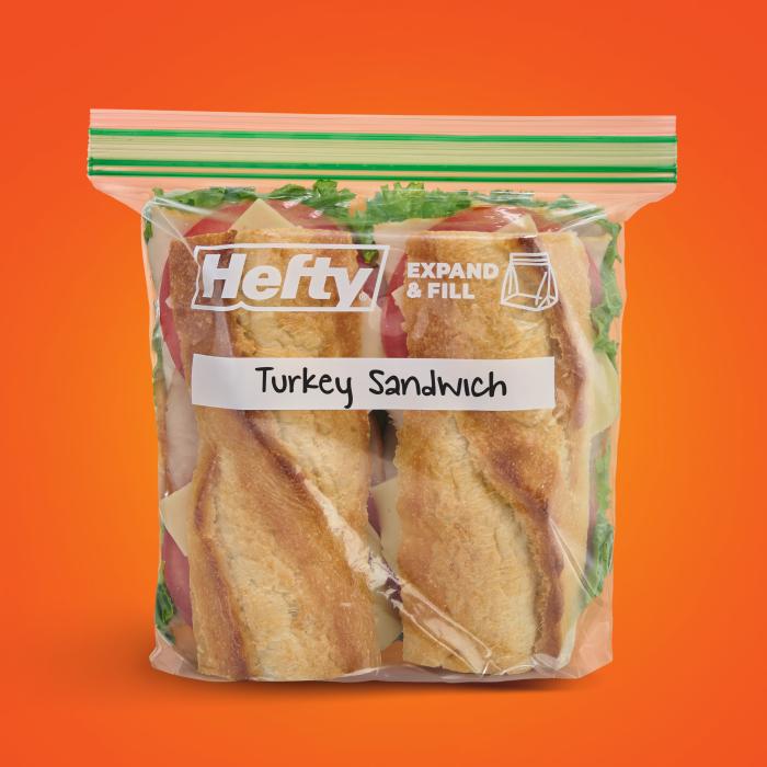 Turkey sandwich on french bread in a sealed Hefty press to close sandwich bag