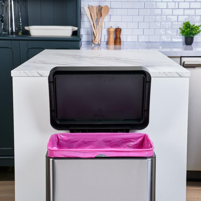 Hefty Ultra Strong pink trash bag in a stainless steel trash can
