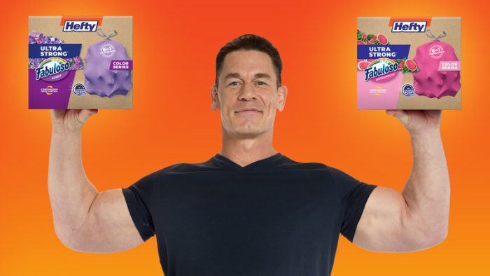 John Cena holding boxes of Hefty Ultra Strong Color Series trash bags
