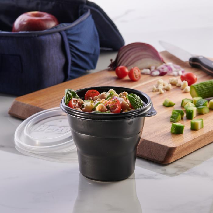 Hefty Multi-Purpose Cup filled with a Mediterranean salad next to a lunch box